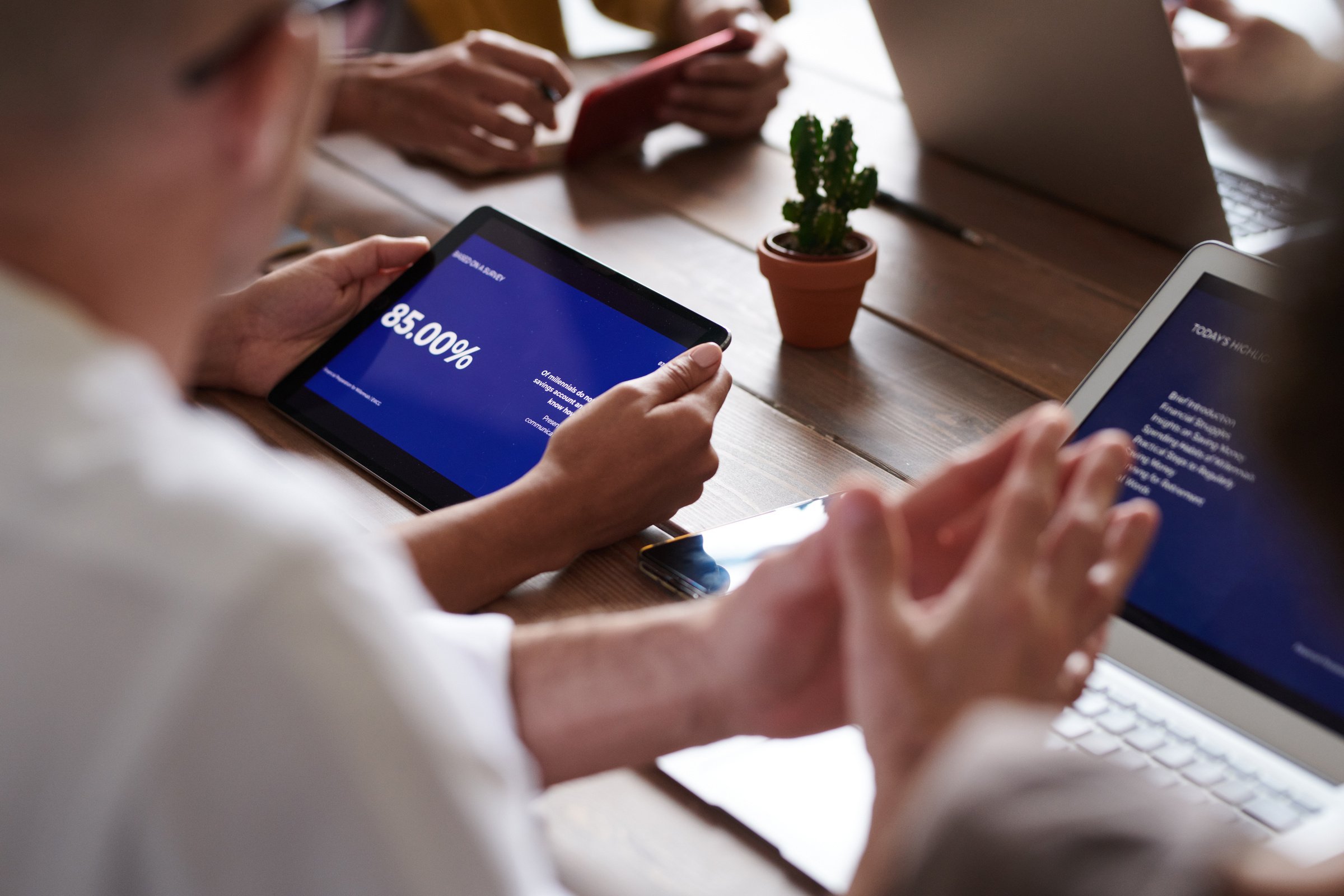 Selective Focus Photo of a Person Holding a Tablet